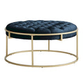 Pouf rond touffeté en velours et finition dorée