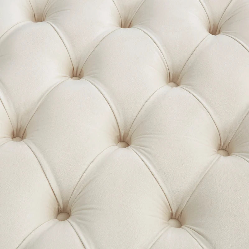 Pouf rond touffeté en velours et finition dorée